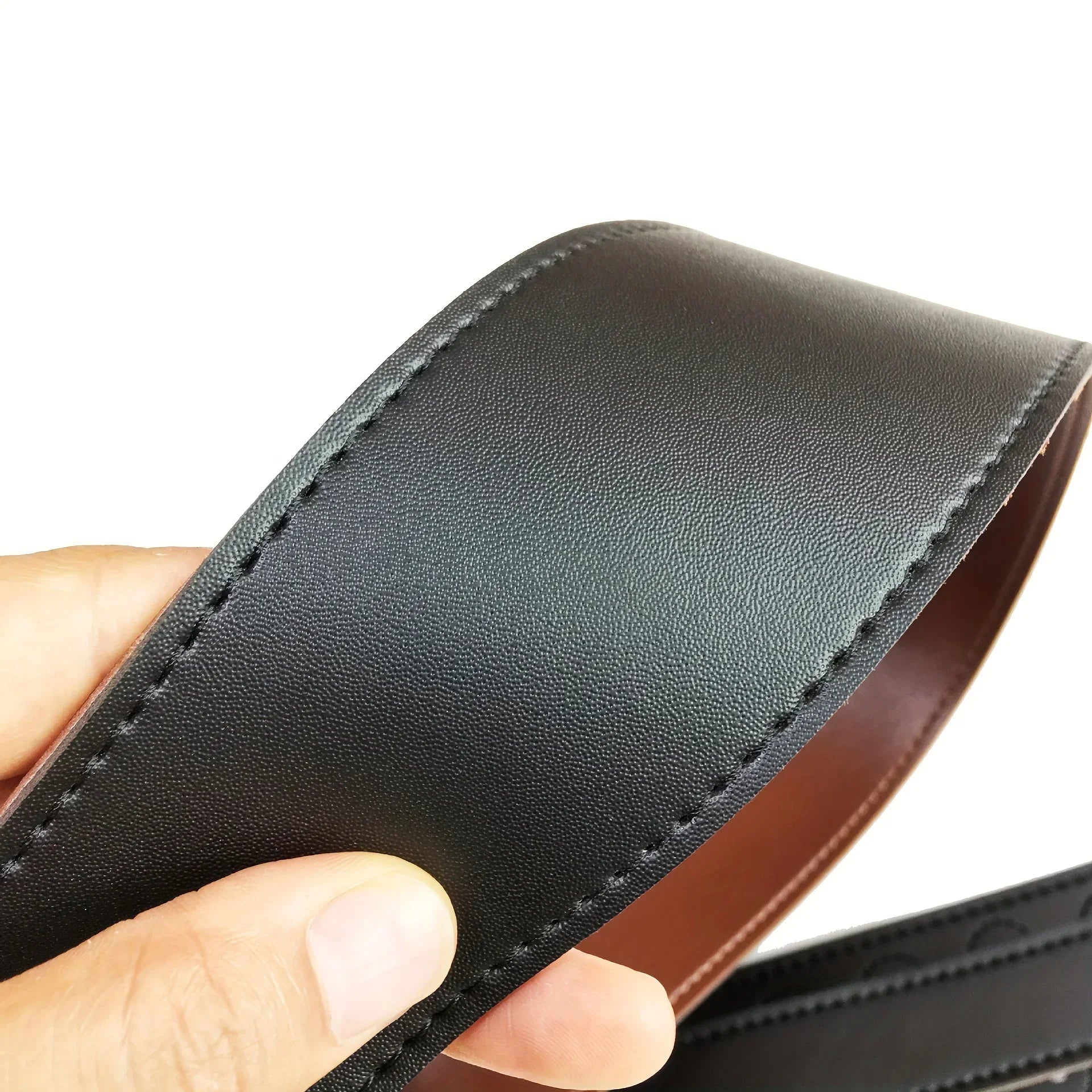 Black leather guitar strap with brown inner lining and precise stitching for electric acoustic bass guitars adjustable length