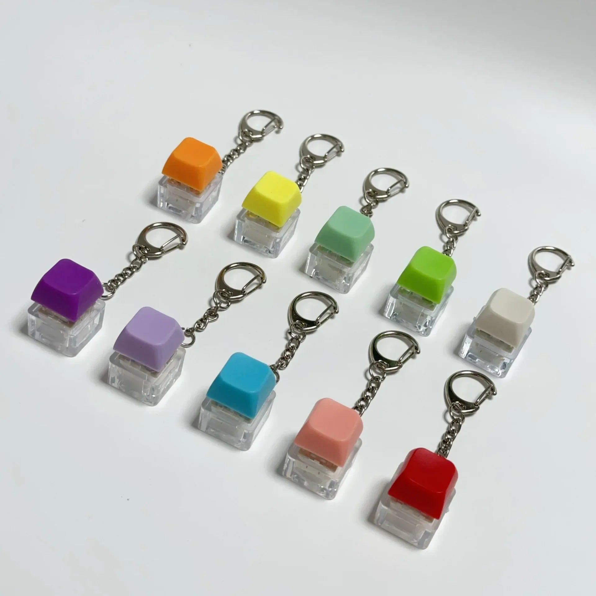 A set of colorful translucent keyboard key chain toys in vibrant hues for chain toy stress relief diy button use