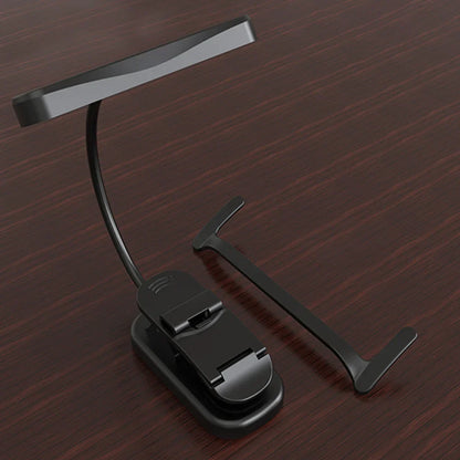 Black rechargeable clip-on music stand light with sleek curved arm matte finish and stepless dimming feature
