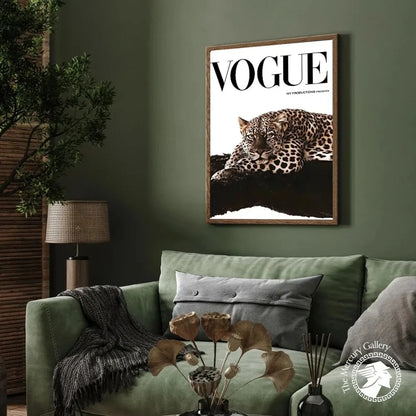 A framed vogue magazine cover with a black and white leopard on dark rock in a wooden frame for fashion wall art