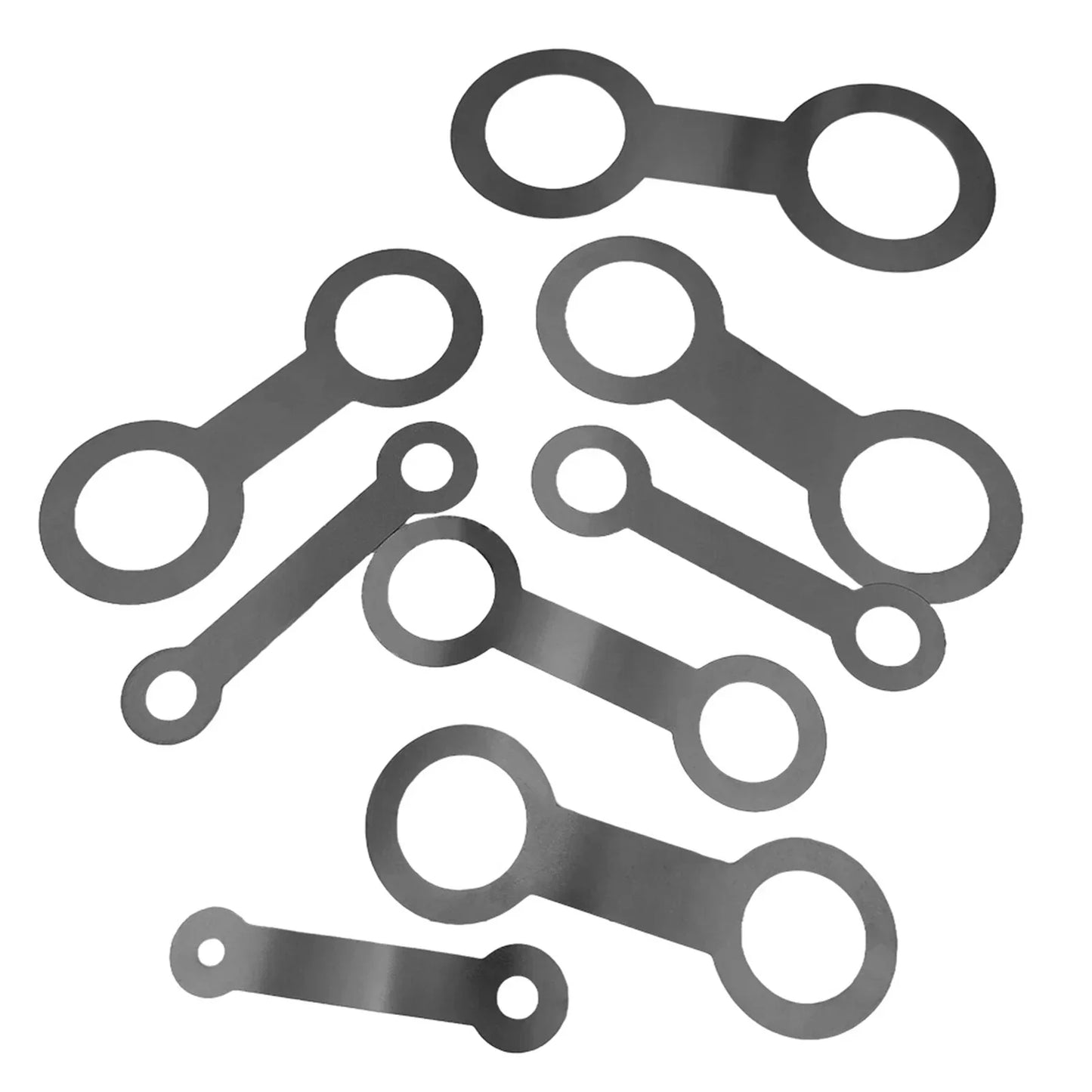 Set of metallic gray oval-shaped gaskets with two holes for saxophone sound hole pad leveling and instrument maintenance replacement