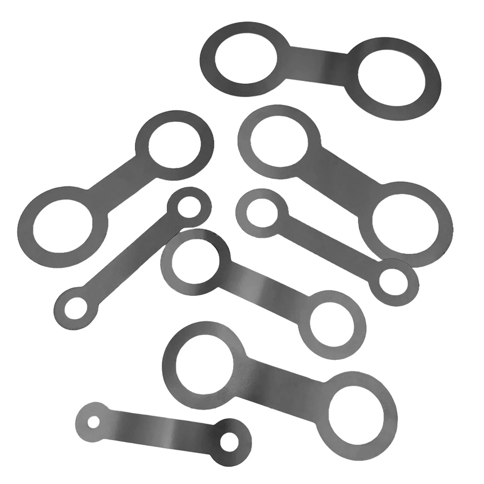 Set of metallic gray oval-shaped gaskets with two holes for saxophone sound hole pad leveling and instrument maintenance replacement