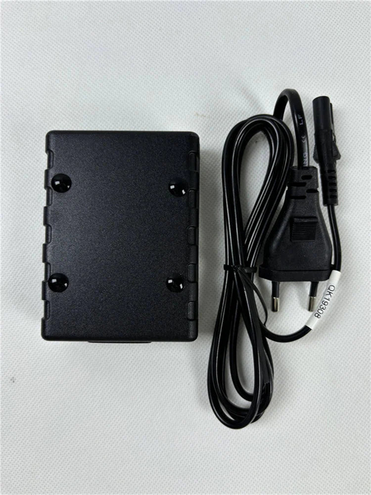 Black plastic mains noise tester power adapter with coiled cable and european plug for emi measuring instrument use