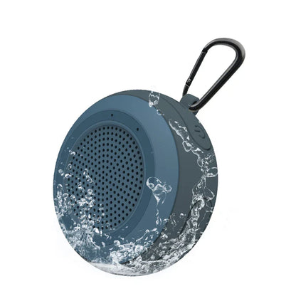 Dark gray cyboris t101 portable wireless ipx7 waterproof floating speaker with black carabiner clip and water splashes graphic