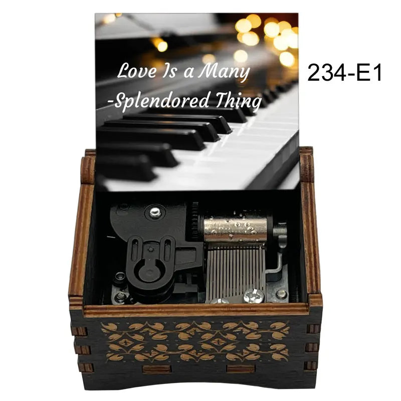 Dark wood music box with gold leaf inlay and piano keyboard lid featuring famous movie melody for fans girlfriend couple