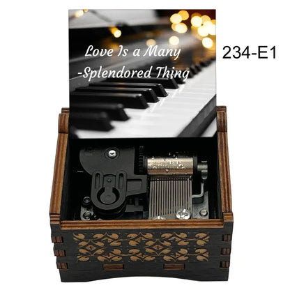 Dark wood music box with gold leaf inlay and piano keyboard lid featuring famous movie melody for fans girlfriend couple