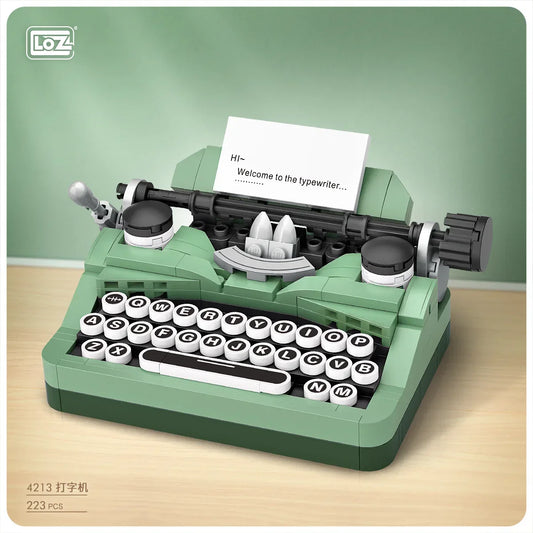 Green lego-style small particle puzzle toy model printer with black and white keys and paper insert greeting message