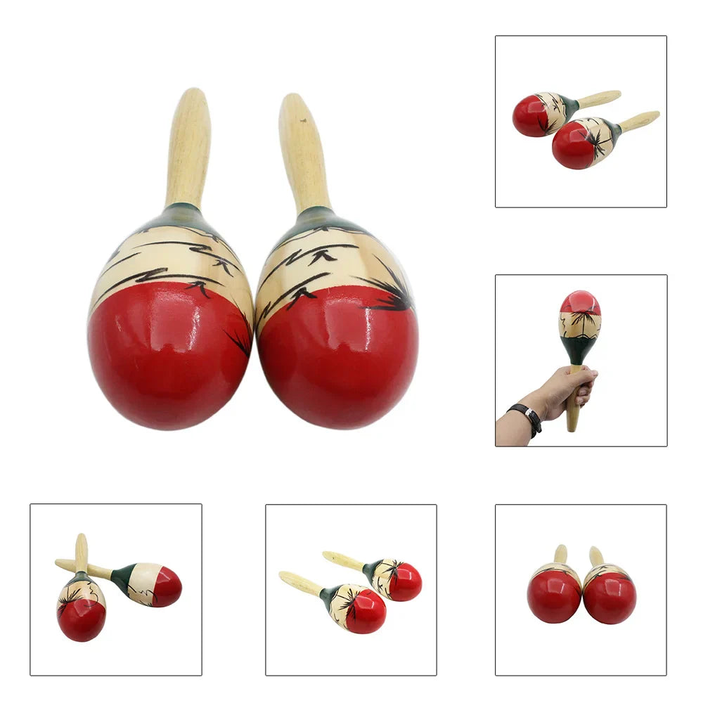 Hand-painted red and cream maracas wooden with black bamboo leaf designs on wooden handles for tropical party percussion