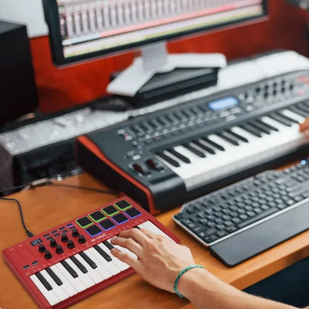 Red m-audio minikey 25 midi control keyboard with 25 velocity sensitive keys and colorful rgb backlit pads compact design