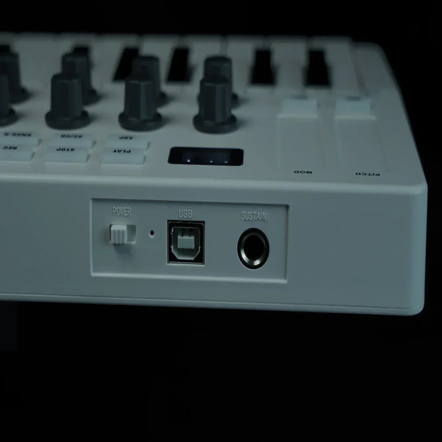 White midi mini portable 25-key usb keyboard midi controller rechargeable with black knobs and usb sustain input ports