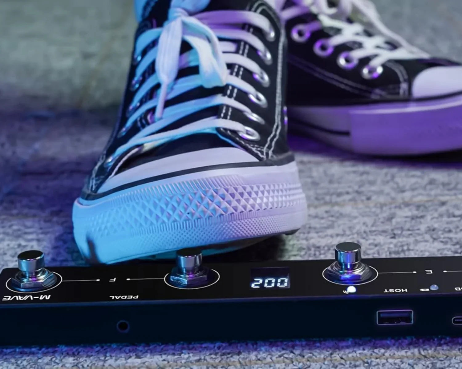 Black m-wave plus portable wireless midi foot controller with silver knobs and digital display for musicians and djs