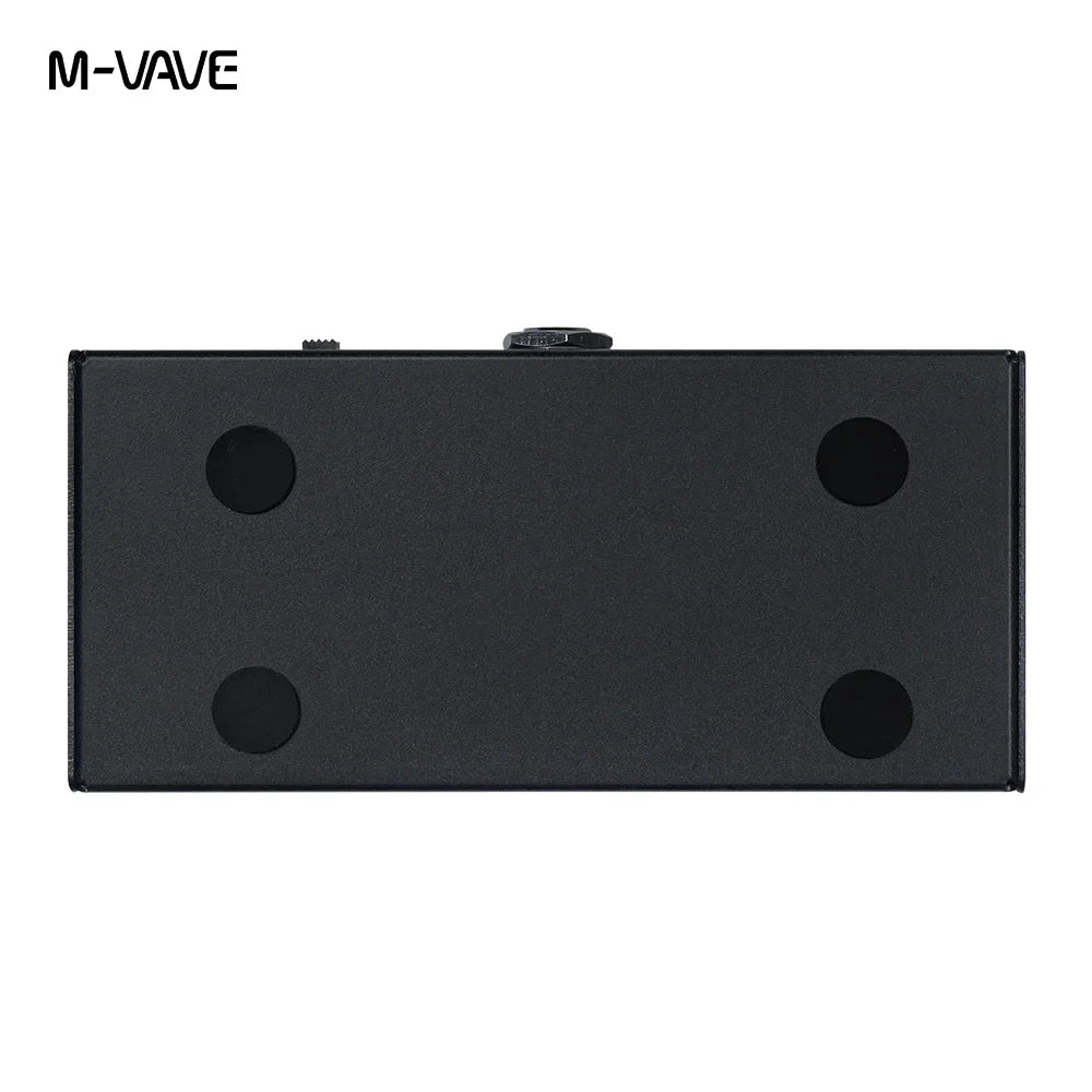 Black m-vave wireless page turner pedal with four circular cutouts and central knob for music sheet supports and looper use