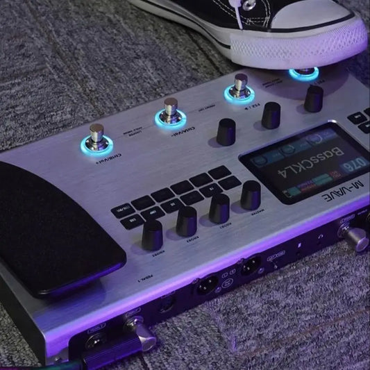 Silver m-audio v-force basskl4 pedalboard with illuminated knobs and digital display featuring ann neural modeling 120amp 360fx 10h battery