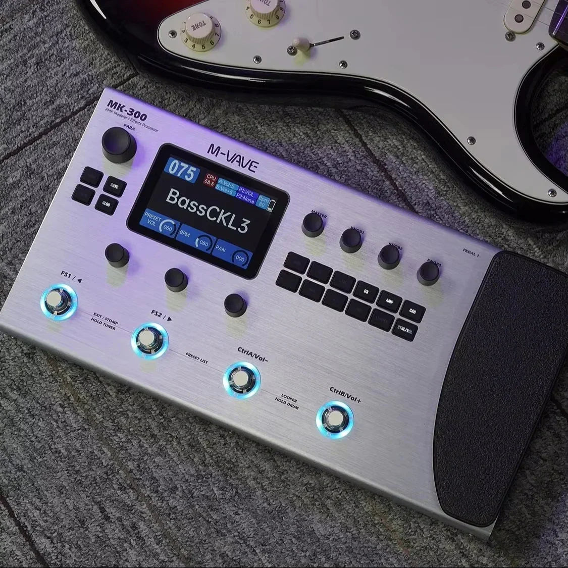 Silver m-audio mk-300 bass guitar effects processor with brushed metal finish and illuminated blue led buttons featuring usb xlr midi and drum machine usb connectivity