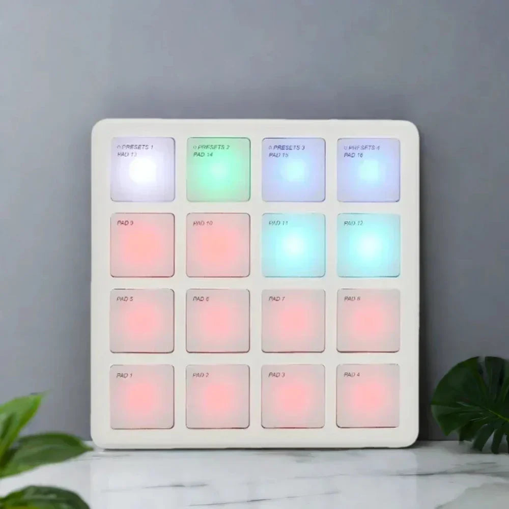 White rectangular m-vave sk-16 smc-pad wireless midi controller with 16 multicolored pads and pad usb-c interface