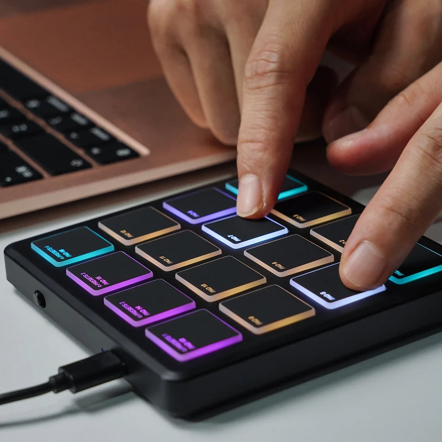 Black rectangular m-vave smc-pad portable wireless midi controller with 16 illuminated rainbow backlit pads suitable percussion
