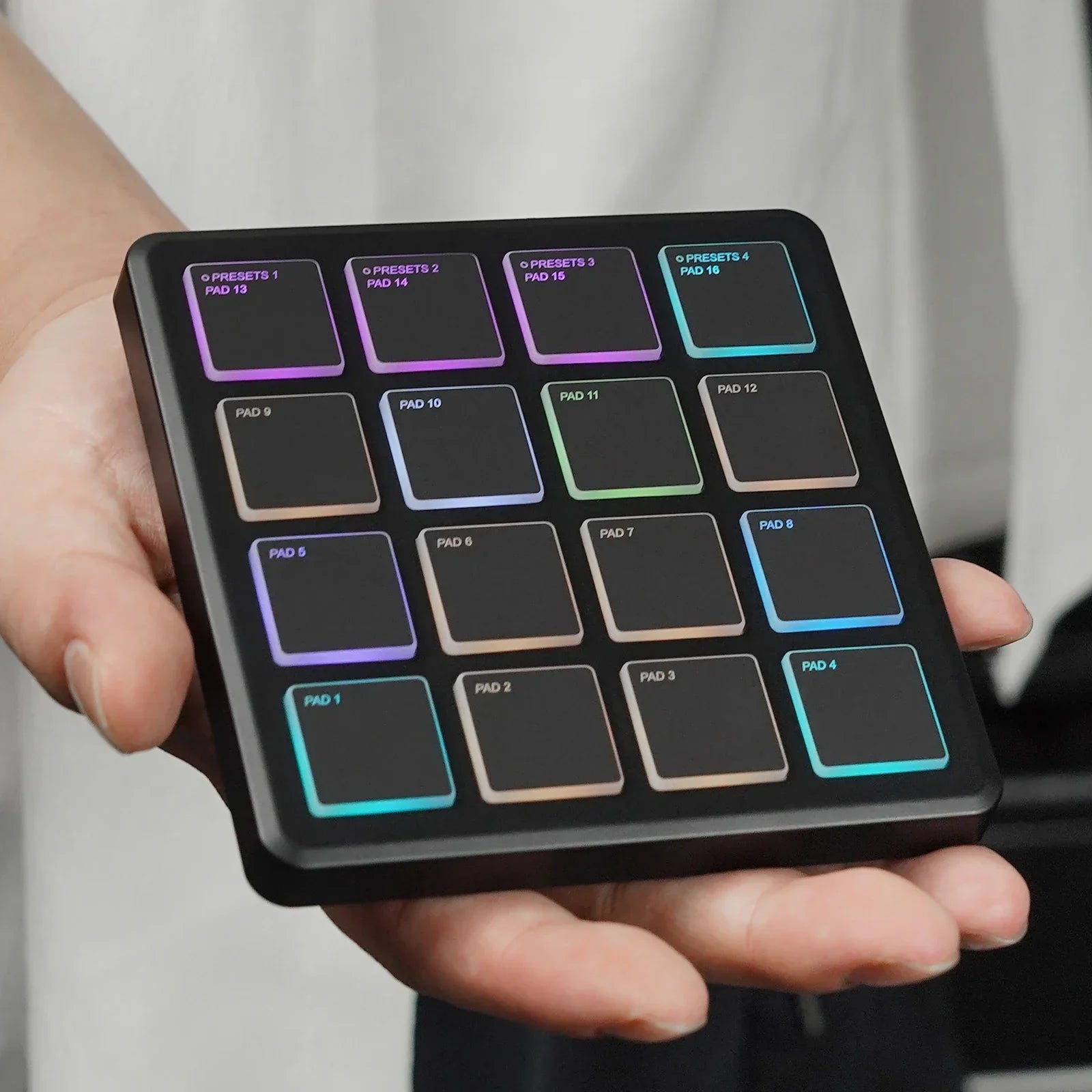 Black rectangular m-vave smc-pad portable wireless midi controller with 16 illuminated pads suitable percussion use