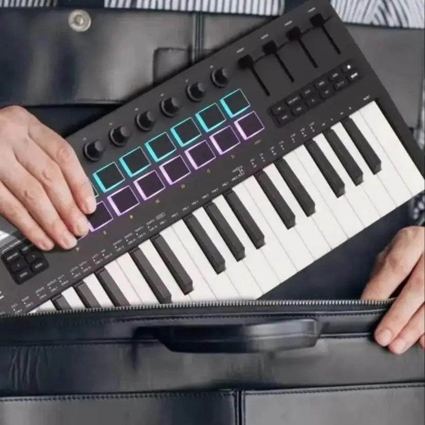 Black m-vave smk-25 midi controller with 25 velocity-sensitive semi-weighted keys and illuminated teal and purple pads