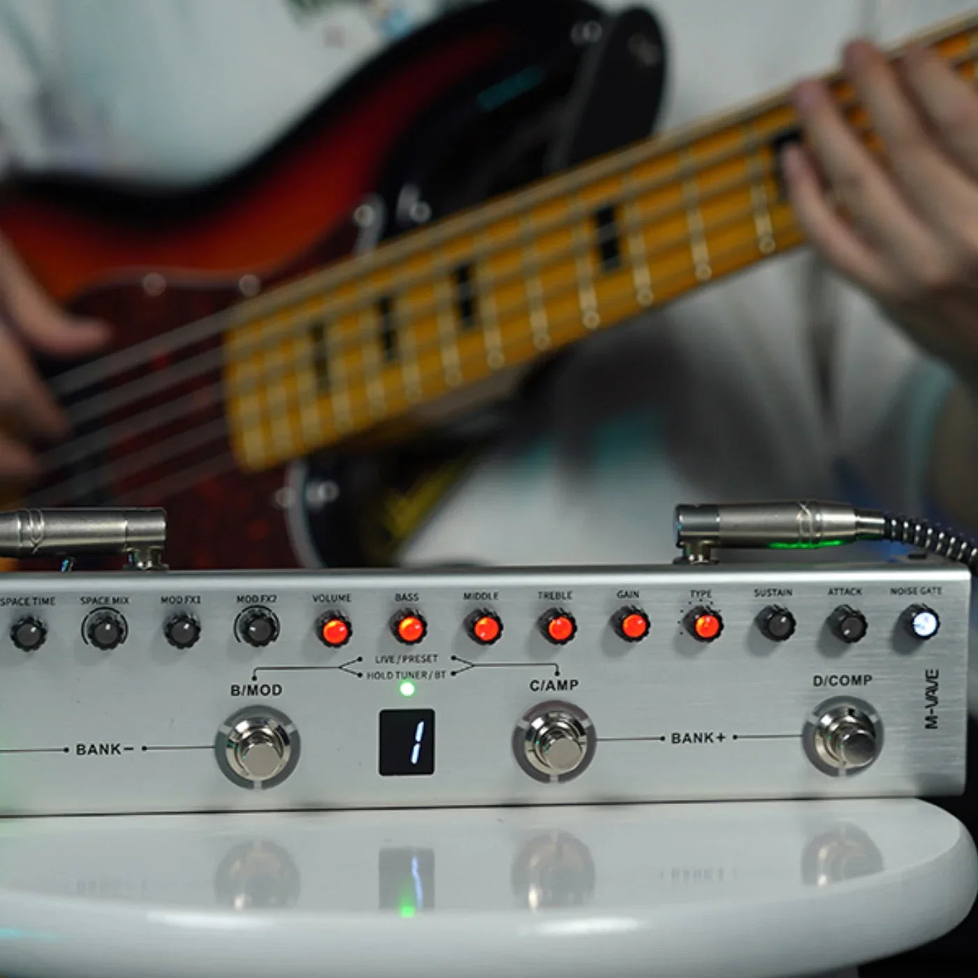 Silver metal M-VAVE TANK-B digital multi-effects guitar pedal with red illuminated knobs and black labeled controls