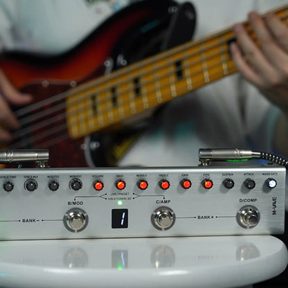 Silver metal M-VAVE TANK-B digital multi-effects guitar pedal with red illuminated knobs and black labeled controls