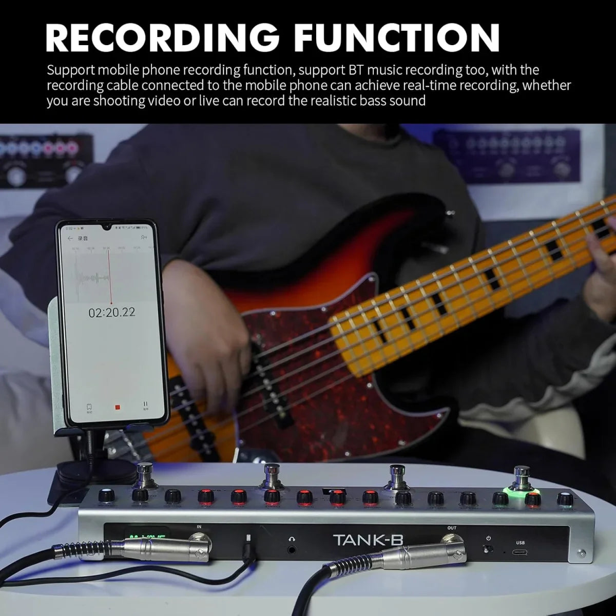 Silver tank-b digital multi-effects guitar pedal with black knobs and red lights connected to smartphone for recording