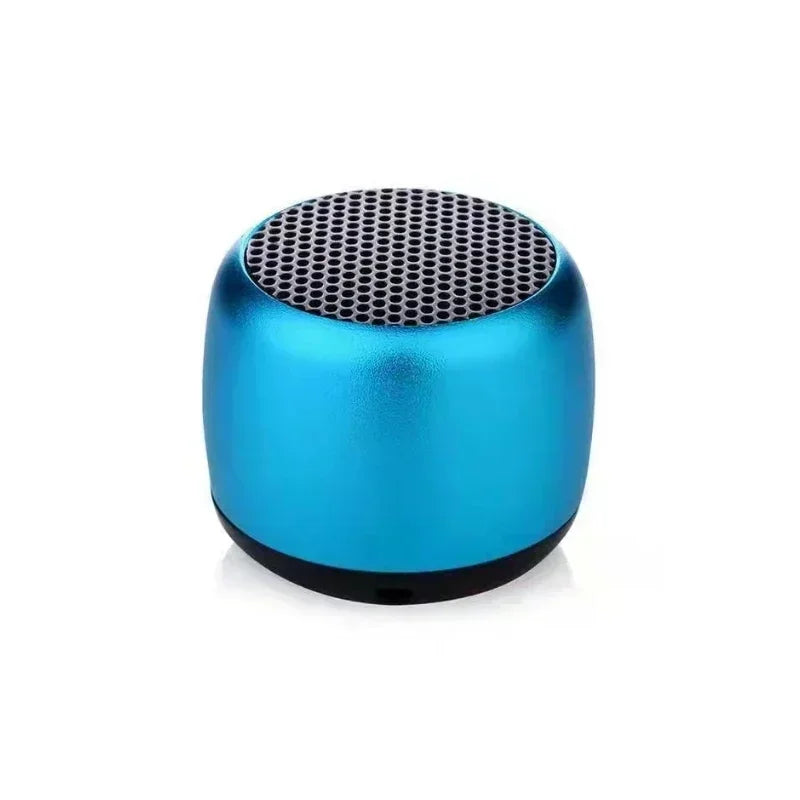 A compact blue portable bluetooth speaker with a black grille and matte finish for outdoor subwoofer speaker use