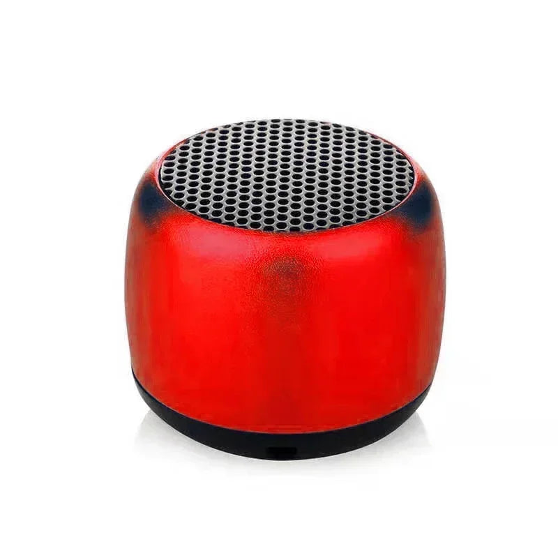 Red and black portable bluetooth speaker with perforated grille top designed as an outdoor subwoofer speaker and audio player