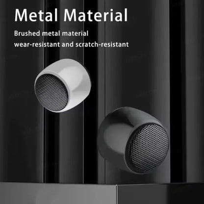 Brushed metal inlaid earbuds with sleek rounded design and perforated grilles for portable bluetooth speaker use