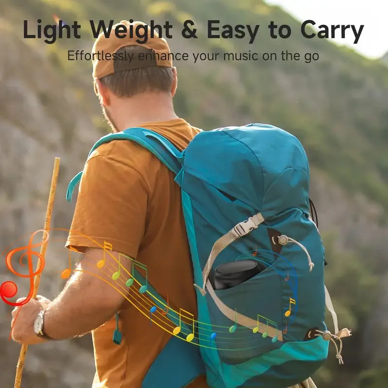 Teal waterproof backpack with black circular compartment designed for portable bluetooth speaker and outdoor subwoofer speaker