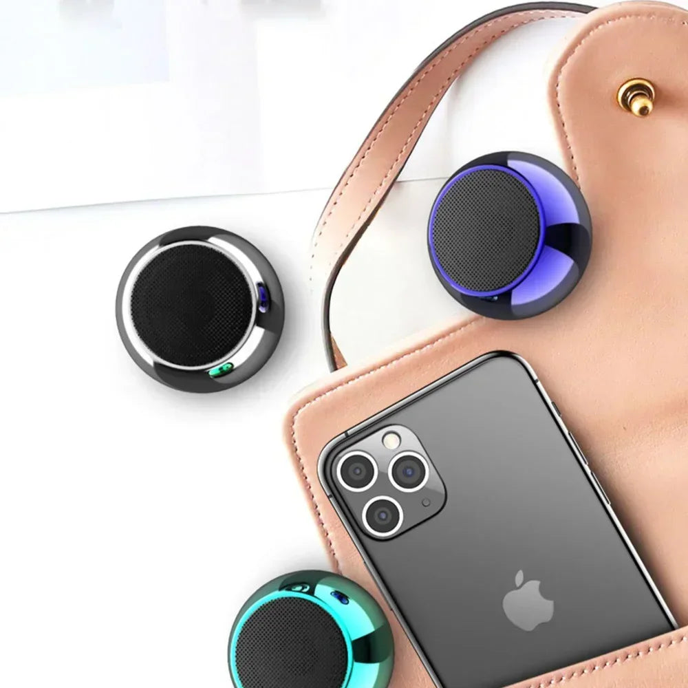 Compact circular m3 wireless bluetooth speakers in black blue and teal with glossy metallic finish and metal stereo surround