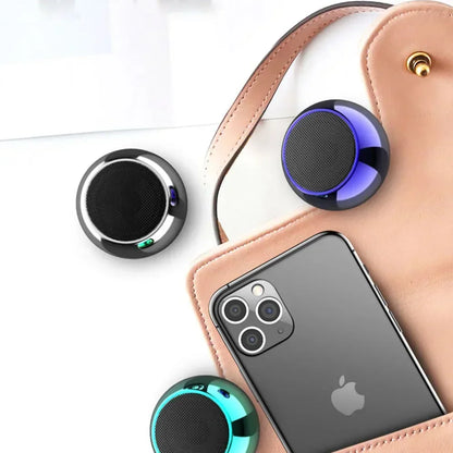 Compact circular m3 wireless bluetooth speakers in black blue and teal with glossy metallic finish and metal stereo surround