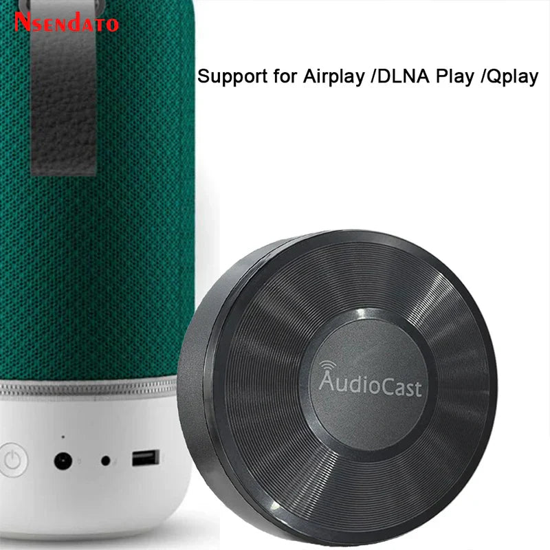 Green textured fabric music audio speaker with white base and black audiocast wireless dlna airplay adapter spotify streamer