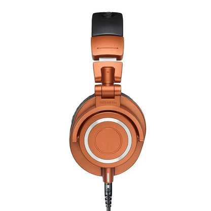 Copper-colored m50x hifi professional fully enclosed foldable game music headset with sleek metallic finish and black padded headband