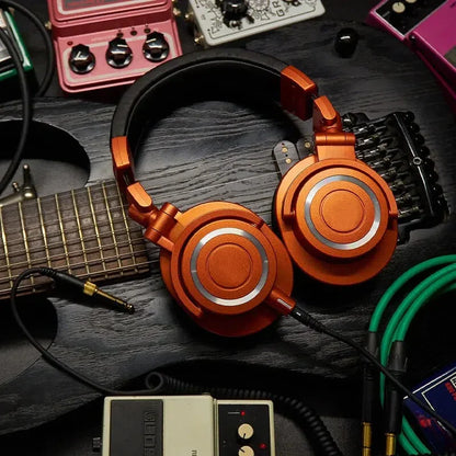 Orange metallic m50x hifi professional fully enclosed foldable game music headset with silver accents and black headband