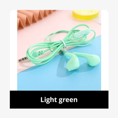 Light green macaron universal 3.5mm stereo wired earphones with soft silicone tips for enhanced sound quality and active noise-cancellation