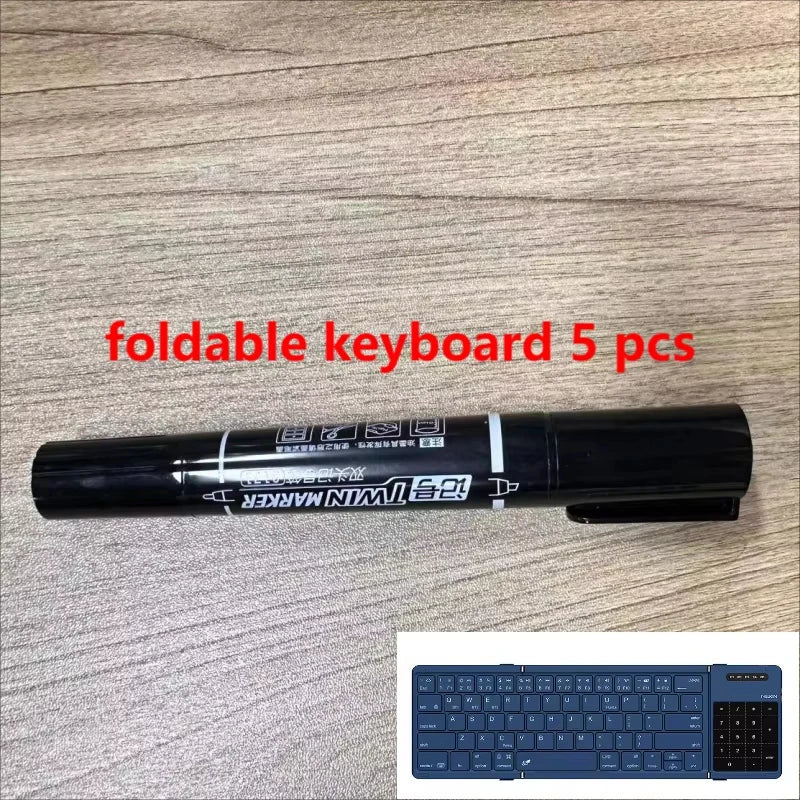 Black dual-tip marker with white labeling and clip next to manchez e4 e7 mini sound card mixer for professional computer recording