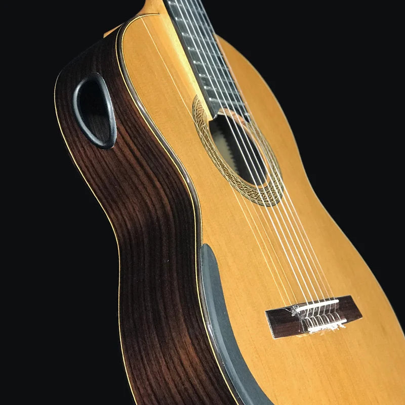 Master level Aiersi classical guitar with light golden body dark wood sides and intricate Aiersi lattice bracing rosette design