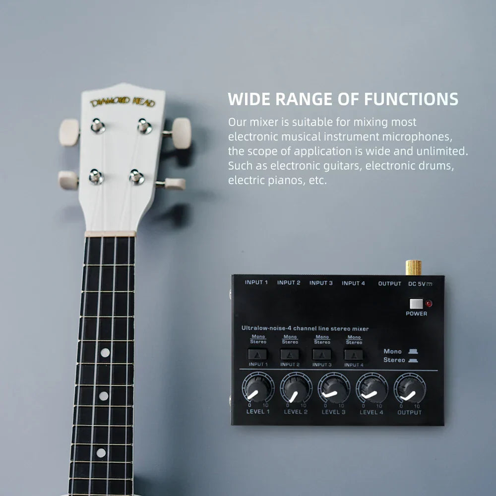 White ukulele with black fretboard next to black max400 audio mixer stereo mixer ultralow for electric guitar drum use