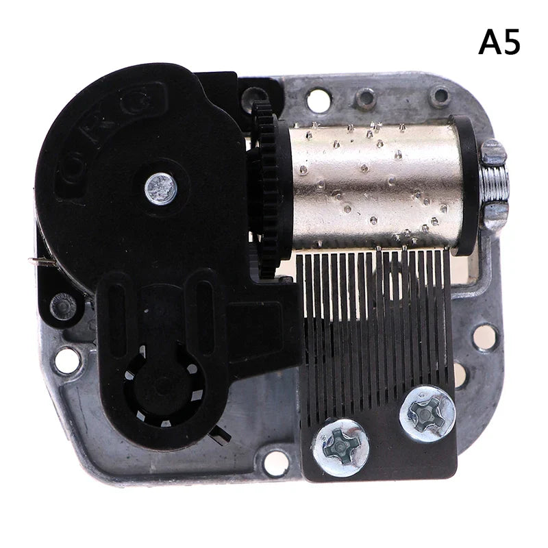Black and silver mechanical diy windup music box sankyo showing visible gear, metal cylinder, screws, and internal components