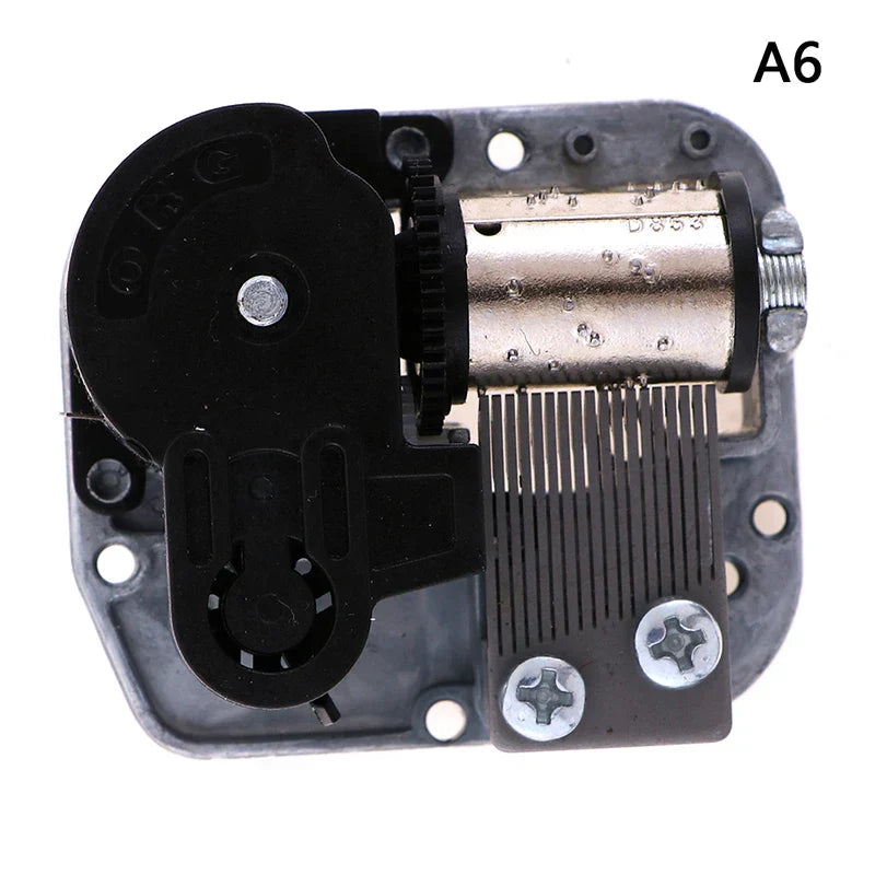 Mechanical DIY windup music box sankyo with black plastic and metallic mechanism featuring silver-toned cylinder and gears