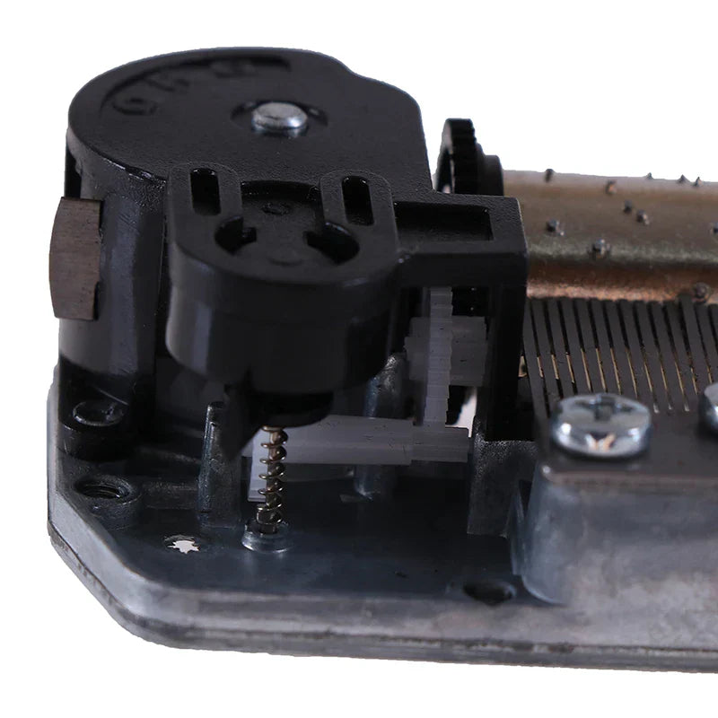 Black plastic and metal mechanical diy windup music box sankyo movement with visible gears springs and brass component