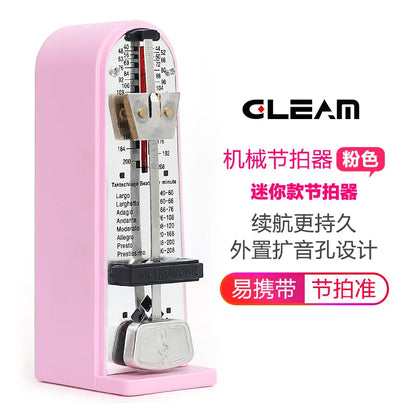 Pink mechanical metronome with silver pendulum and black accents featuring tempo markings for piano guzheng and guitar use