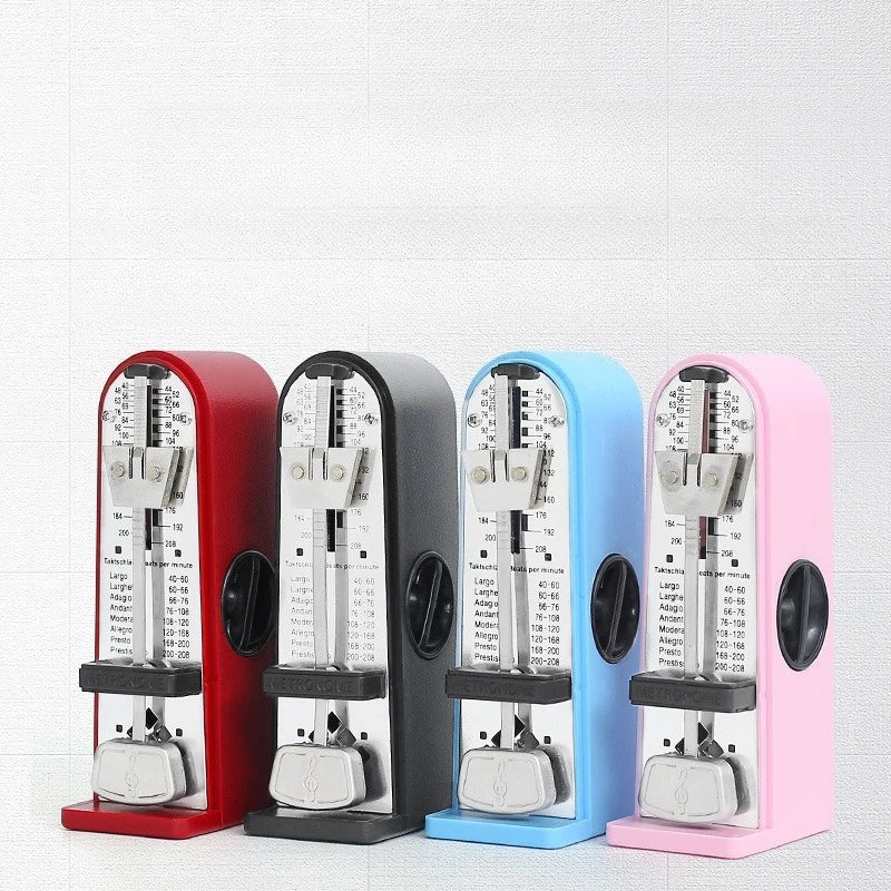 Four colorful mechanical metronomes in red black blue and pink with metallic silver accents for piano guitar and guzheng use
