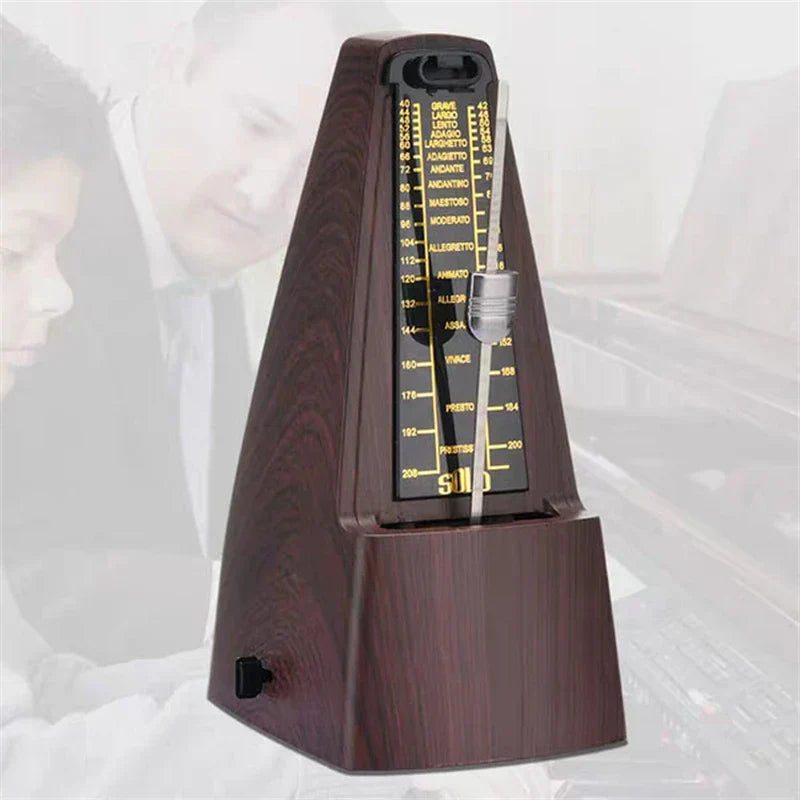 Dark wood finish mechanical metronome with black and gold face for piano guitar violin bass drum precision timing