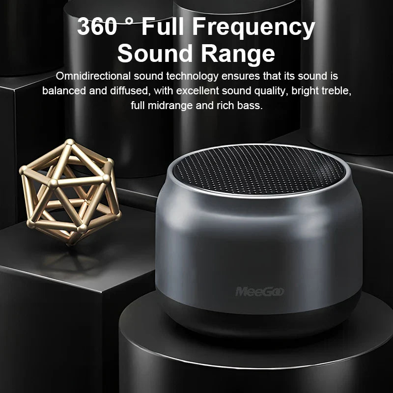 A sleek matte black meegooportable wireless bluetooth speaker with circular grille for laptop mobile gaming and multimedia 3d surround
