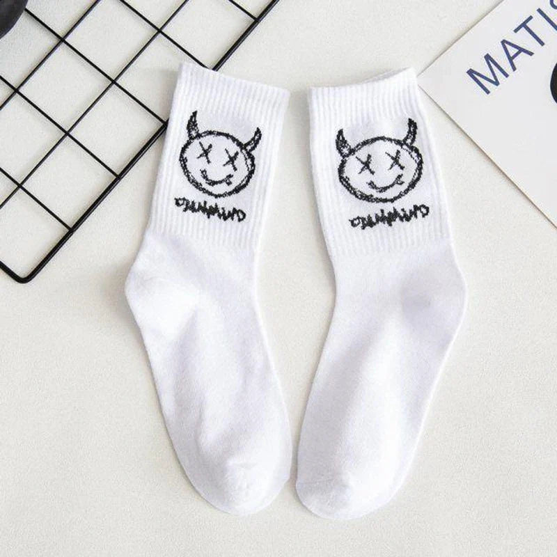 White cotton crew socks featuring a black embroidered devil grimace harajuku with x eyes and dumm graffiti fashion long design