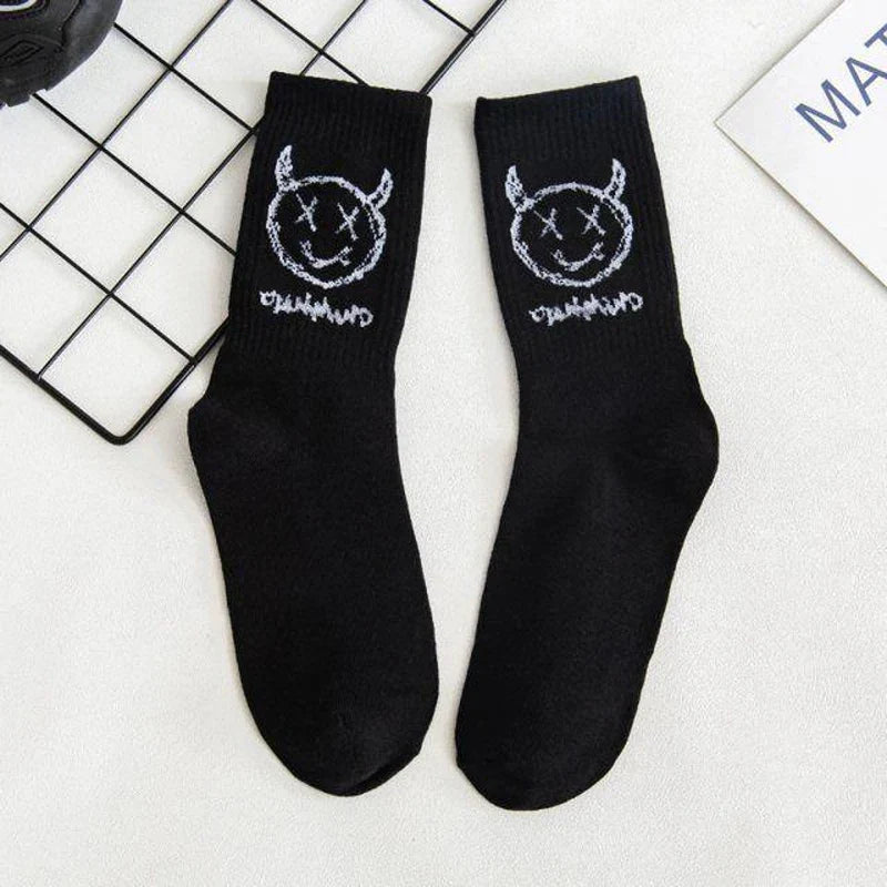 Black cotton crew socks featuring a white embroidered devil grimace harajuku design and graffiti fashion long style for women socks cotton