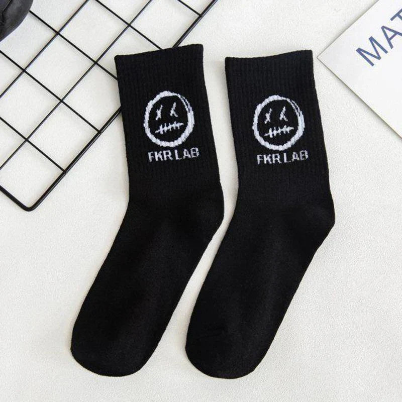 Black cotton crew socks with white devil grimace harajuku smiley face and fkr lab logo for graffiti fashion long wear