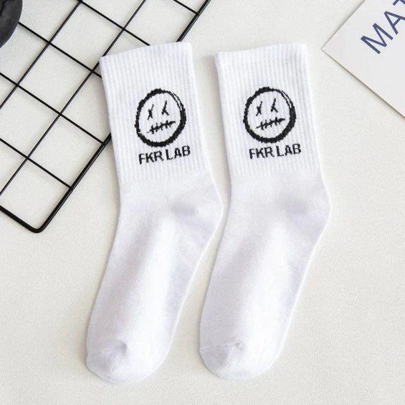 White crew socks cotton with black embroidered smiley face and fkr lab text perfect for graffiti fashion long style