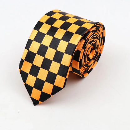 A sleek classic skinny tie with black and orange checkerboard pattern made of smooth satin-like fabric